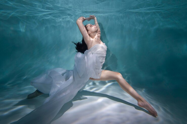 young-woman-posing-submerged-underwater-flowy-dress_23-2149002608